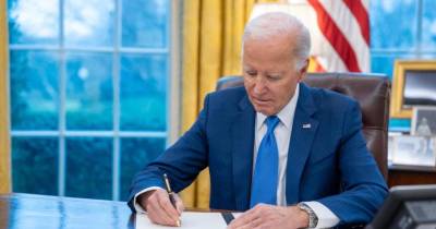 President Joe Biden signs an Executive Order on protecting personnel data, Wednesday, February 28, 2024, in the Oval Office. (Official White House Photo by Adam Schultz)